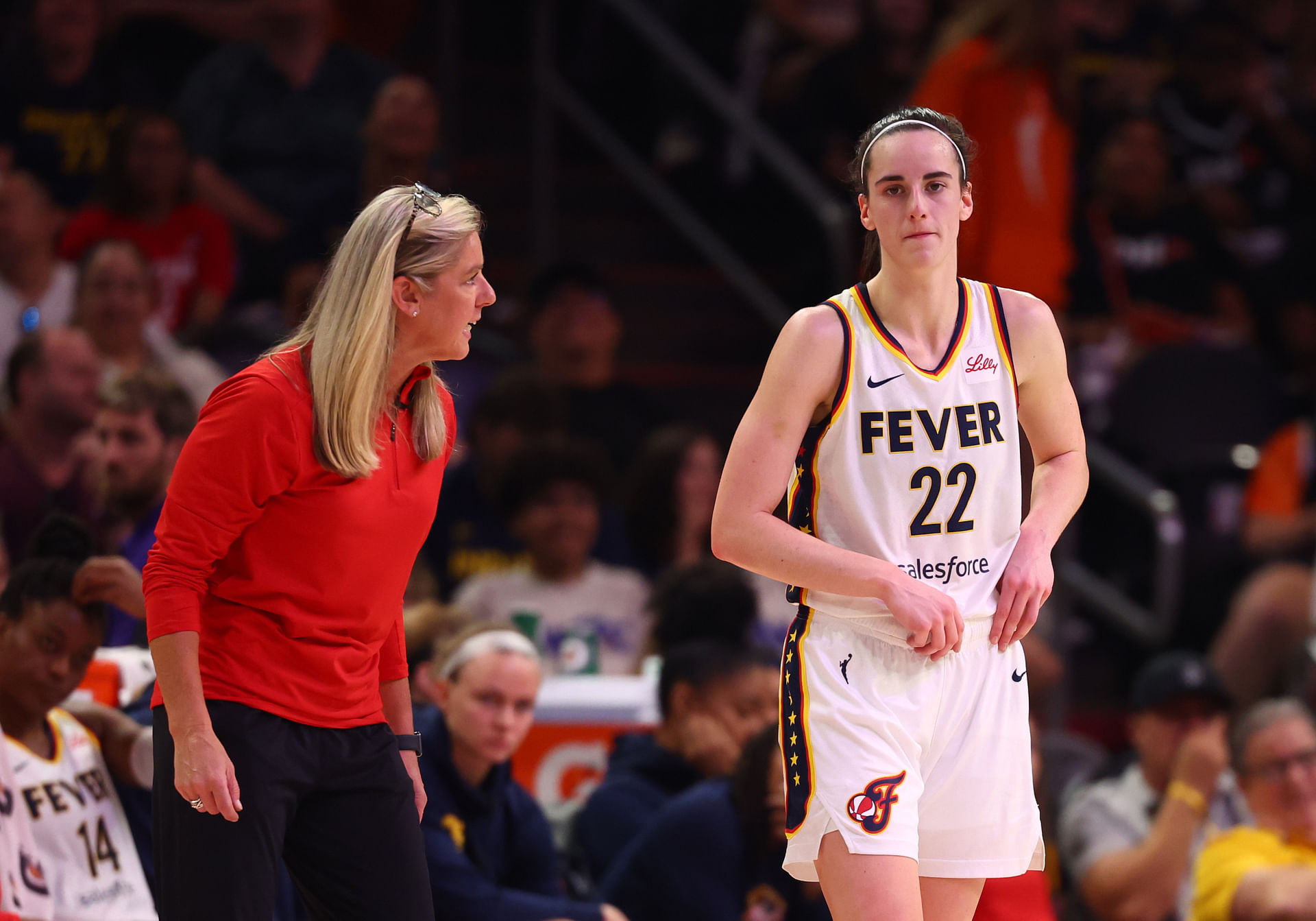 Jun 30, 2024; Phoenix, Arizona, USA; Indiana Fever head coach Christie Sides with guard Caitlin Clark (22) against the Phoenix Mercury during a WNBA game at Footprint Center. Mandatory Credit: Mark J. Rebilas-Imagn Images - Source: Imagn