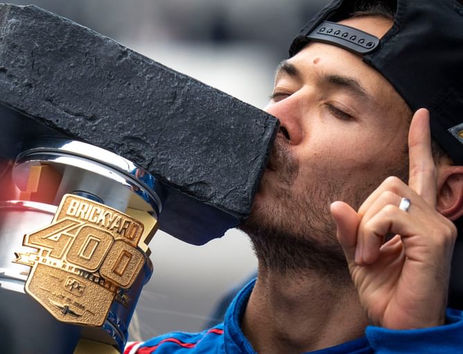 Which NASCAR drivers are attempting the double duty Xfinity-Cup Series run at Indianapolis Motor Speedway?