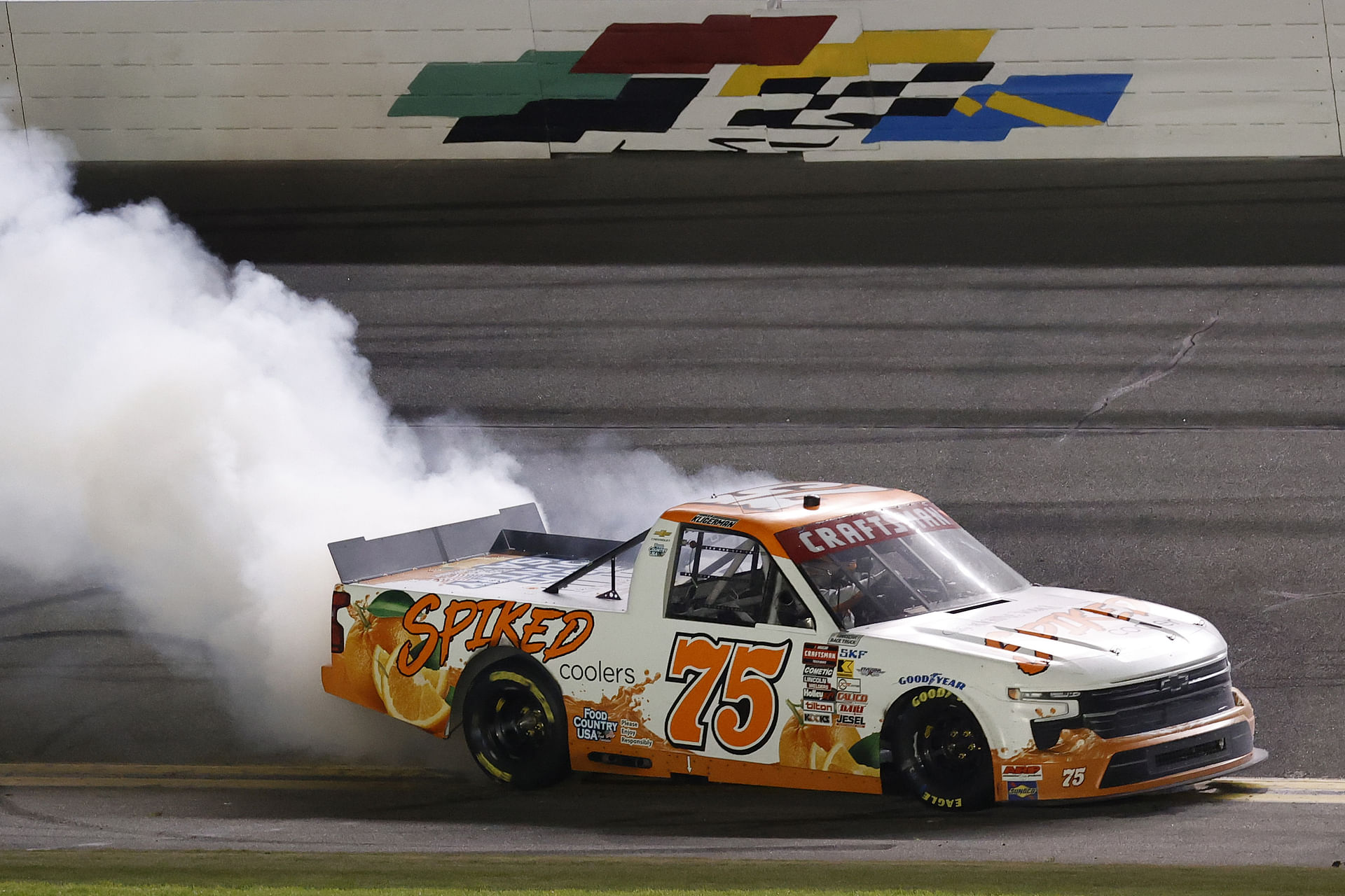 Parker Kligerman (75) does a burnout after winning the Fresh From Florida 250 at Daytona International Speedway. - Source: Imagn