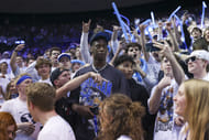 BYU signee AJ Dybantsa joins the student section during the second half of the Cougars' NCAA game against the West Virginia Mountaineers at Marriott Center. Photo: Imagn