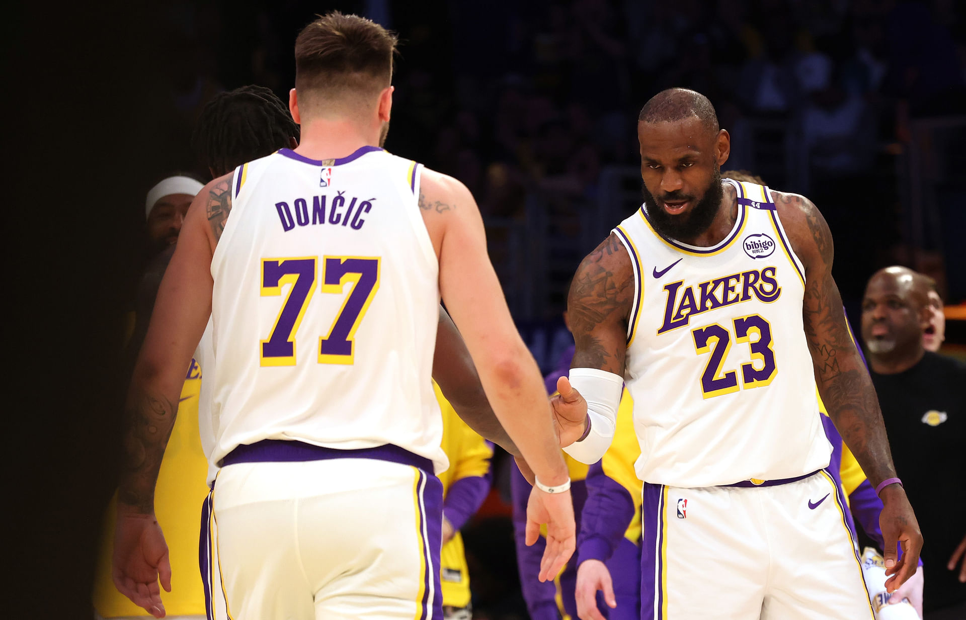 Mar 2, 2025; Los Angeles, California, USA; Los Angeles Lakers forward LeBron James (23) and guard Luka Doncic (77) react after a play during the first quarter against the LA Clippers at Crypto.com Arena. Mandatory Credit: Jason Parkhurst-Imagn Images - Source: Imagn