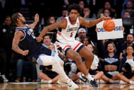 Connecticut Huskies center Tarris Reed Jr. (#5) controls the ball against Villanova Wildcats forward Eric Dixon (43) during the first half at Madison Square Garden. Photo: Imagn