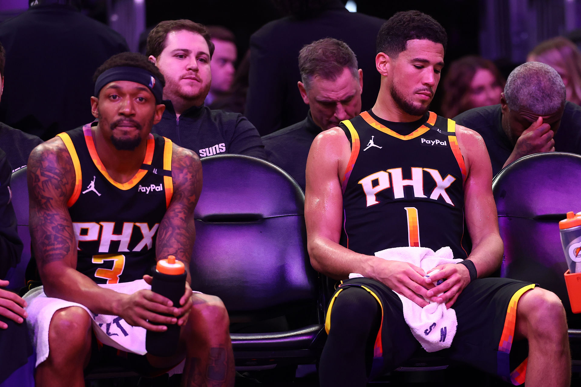 Phoenix Suns guard Bradley Beal (3) and guard Devin Booker (1) react on the bench against the Oklahoma City Thunder during the second half at Footprint Center - Source: Imagn