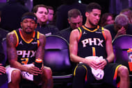 Phoenix Suns guard Bradley Beal (3) and guard Devin Booker (1) react on the bench against the Oklahoma City Thunder during the second half at Footprint Center - Source: Imagn