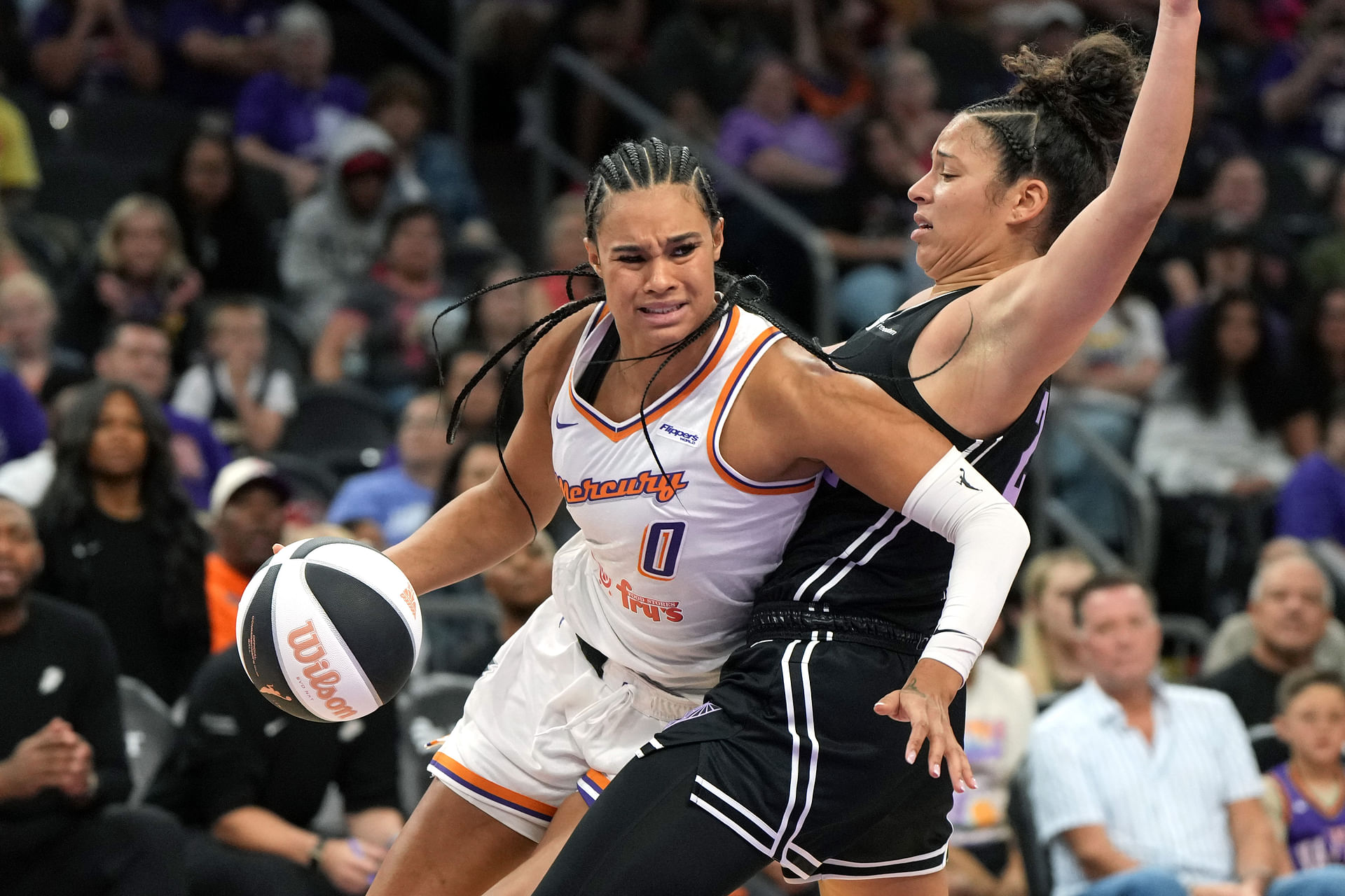 Jun 5, 2025; Phoenix, Arizona, USA; Phoenix Mercury forward Satou Sabally (0) drives around Golden State Valkyries guard Veronica Burton (22) in the second half at Footprint Center. Mandatory Credit: Rick Scuteri-Imagn Images - Source: Imagn