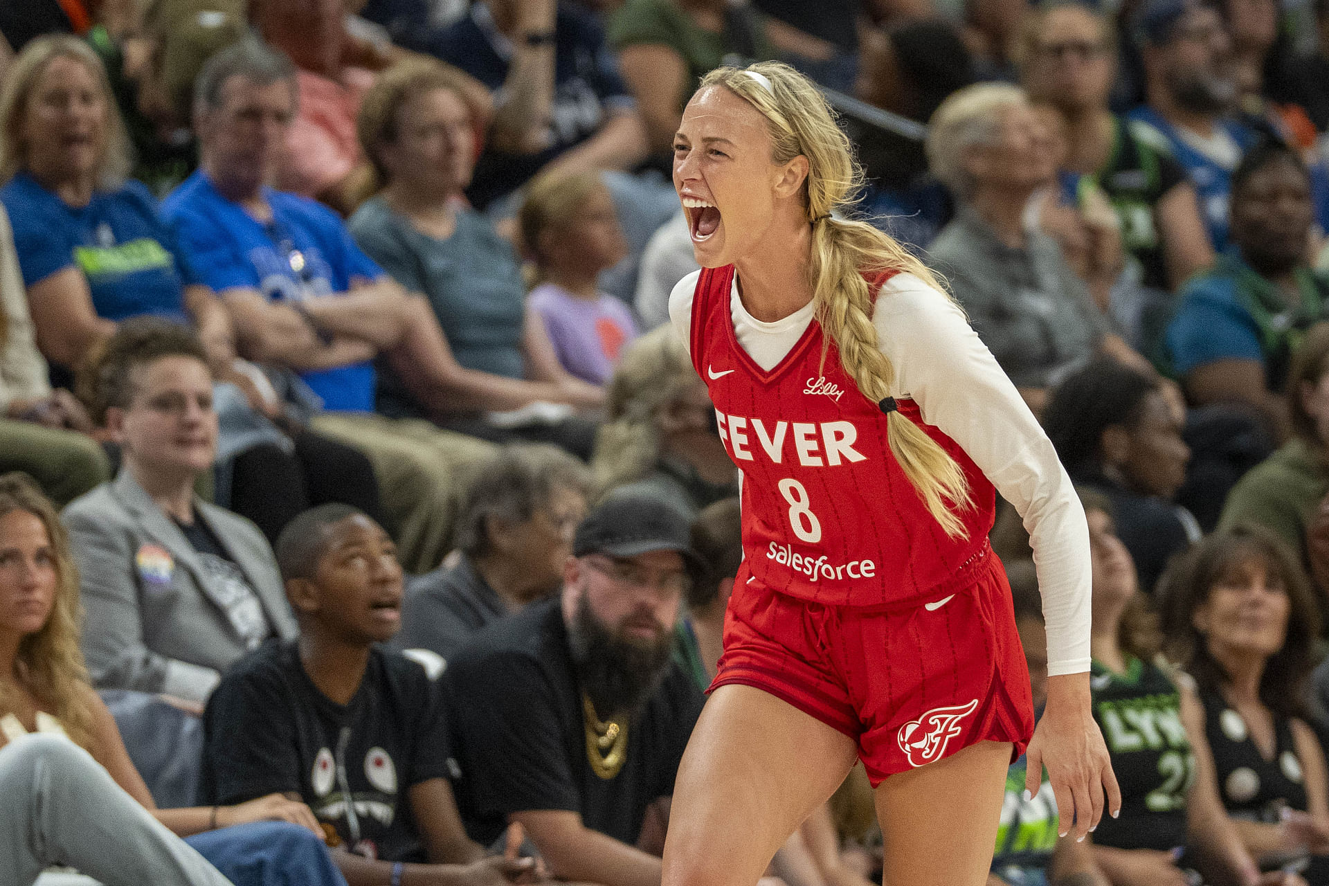 Jul 1, 2025; Minneapolis, Minnesota, USA; Indiana Fever guard Sophie Cunningham (8) celebrates after making a three point shot against the Minnesota Lynx in the second half during the Commissioner