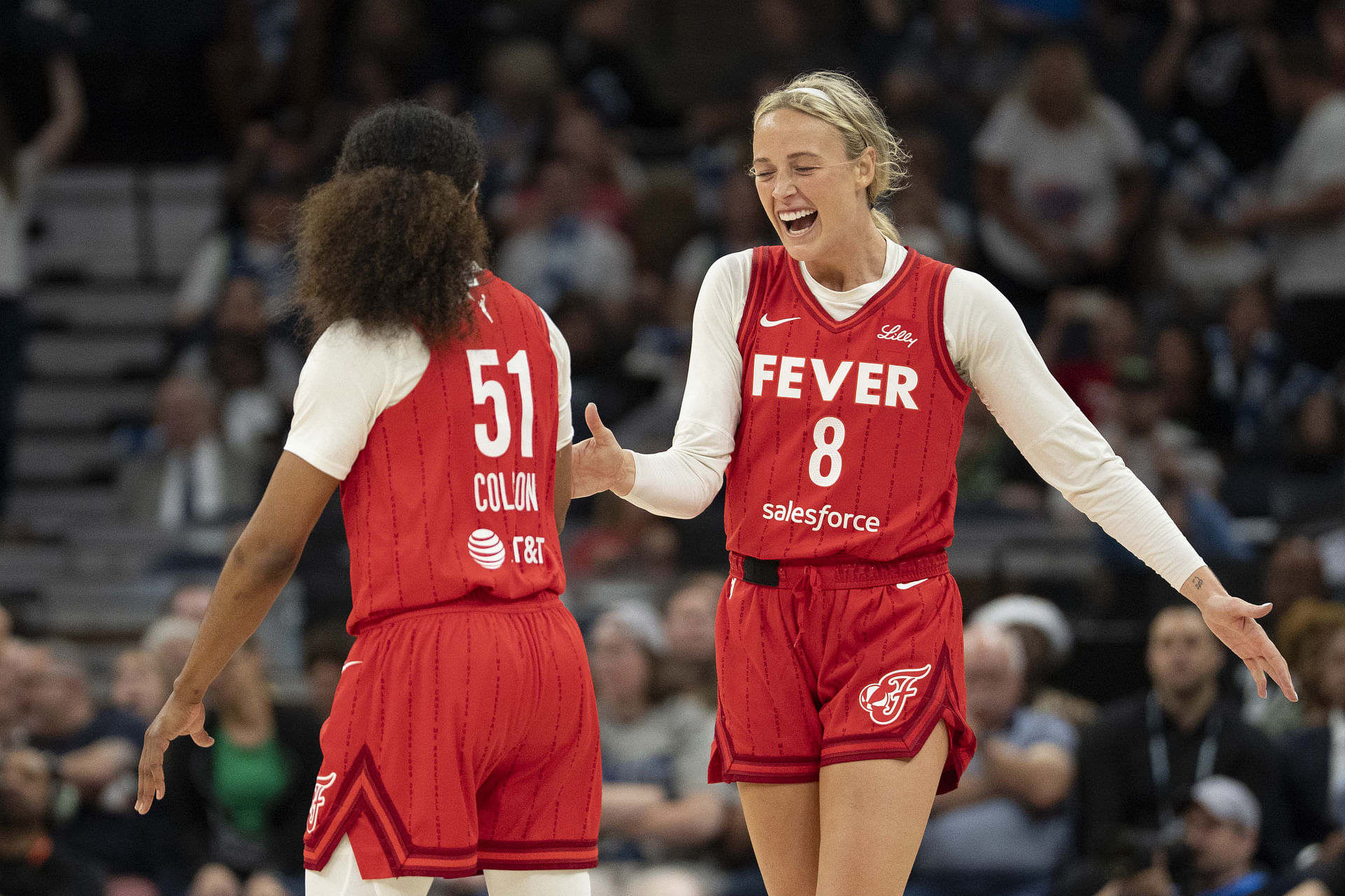 Jul 1, 2025; Minneapolis, Minnesota, USA; Indiana Fever guard Sophie Cunningham (8) celebrates with Indiana Fever guard Sydney Colson (51) after defeating the Minnesota Lynx during the Commissioner