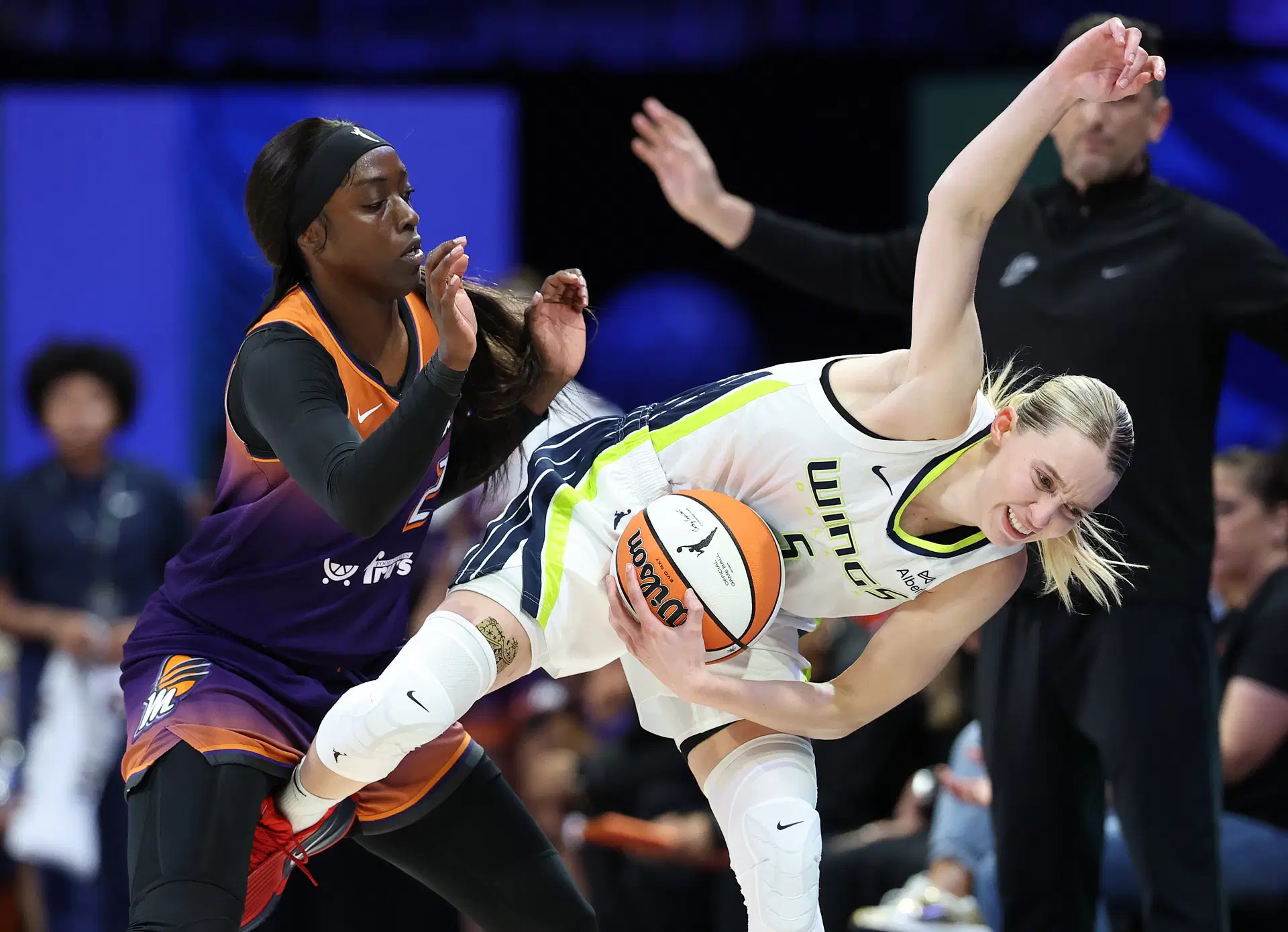 Jul 3, 2025; Arlington, Texas, USA; Phoenix Mercury guard Kahleah Copper (2) fouls Dallas Wings guard Paige Bueckers (5) during the second half at College Park Center. Mandatory Credit: Kevin Jairaj-Imagn Images - Source: Imagn