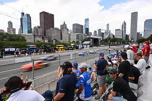 NASCAR throws caution at the Chicago Cup race to let an ambulance pass