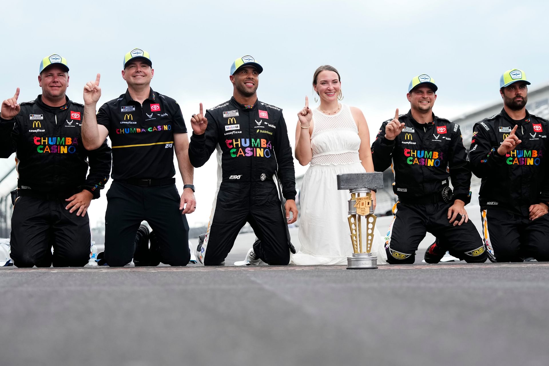 Charles Denike and Bubba Wallace celebrate after the Brickyard 400. Source: Imagn