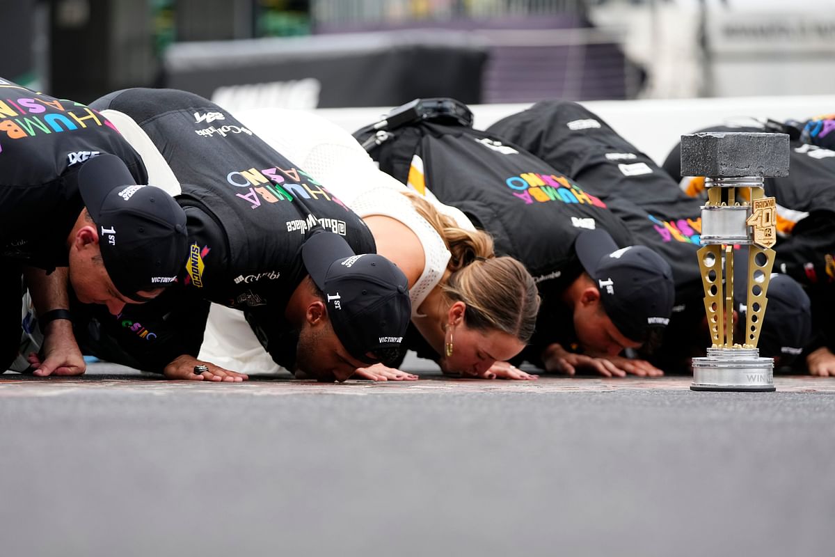 Bubba Wallace joined by 23XI Racing co-owner Denny Hamlin for the tradition of 'kissing the bricks'