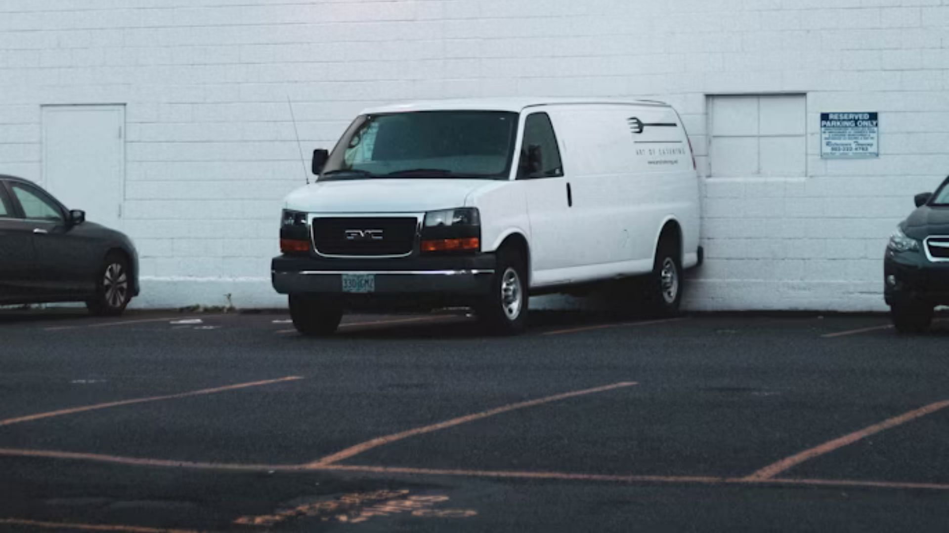 A white Ford Econoline van was standing idle in the parking lot (Representative Image via Unsplash/@Zachary Keimig)