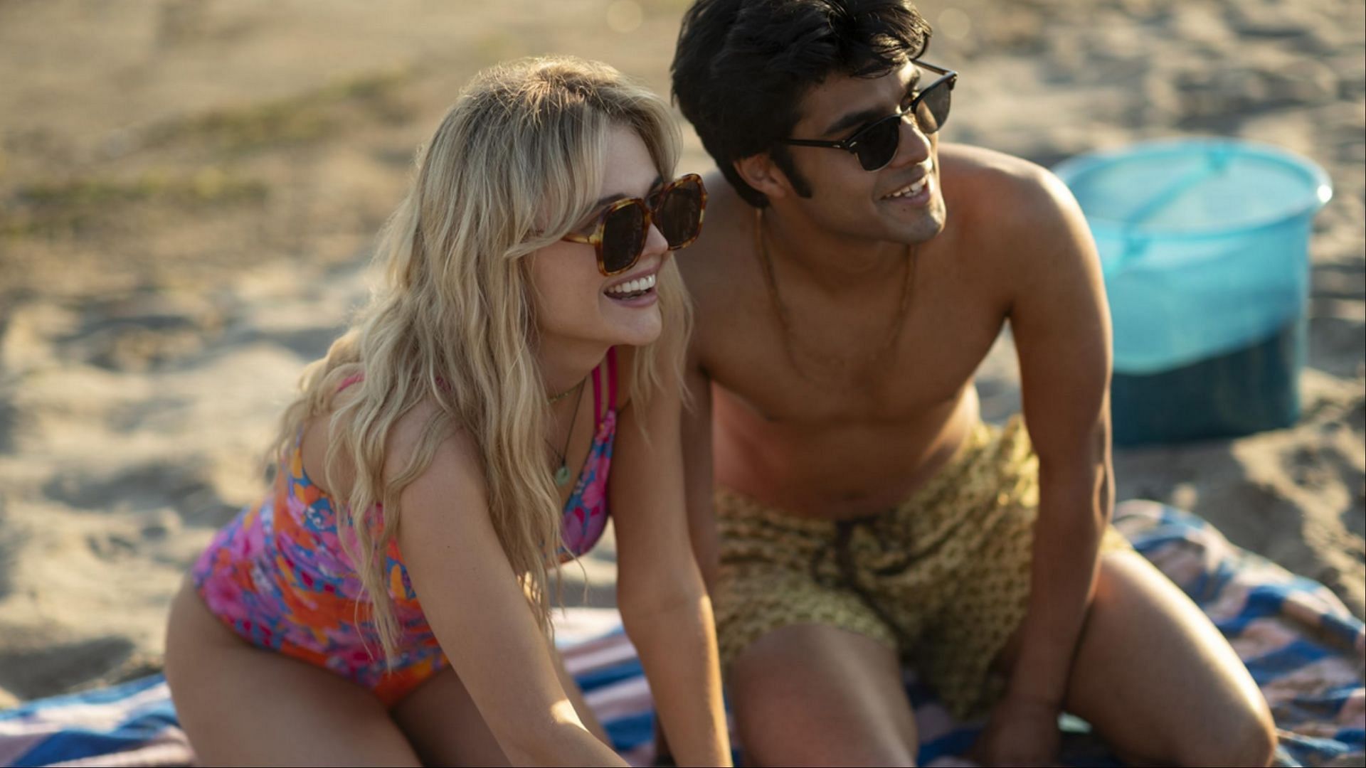 Cady and Gat share a quiet moment on the beach. (Image via Prime video)