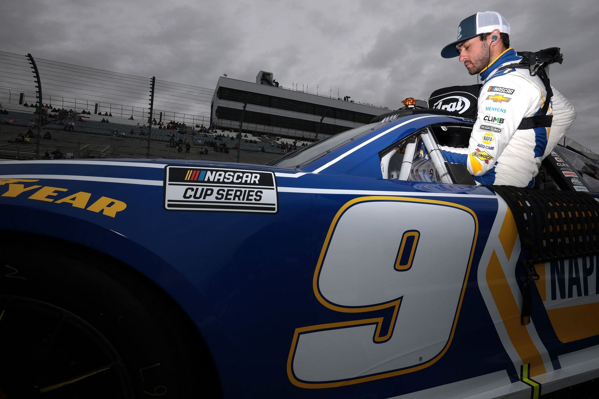 Chase Elliott, driver of the #9 NAPA Auto Parts Chevrolet, enters his car during qualifying for the NASCAR Cup Series W&uuml;rth 400 at Dover International Speedway on April 27, 2024 - Qualifying - Source: Getty
