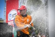 Pato O'Ward spraying the champagne after winning the 2025 NTT INDYCAR Series Ontario Honda Dealers Indy Toronto - Source: Getty