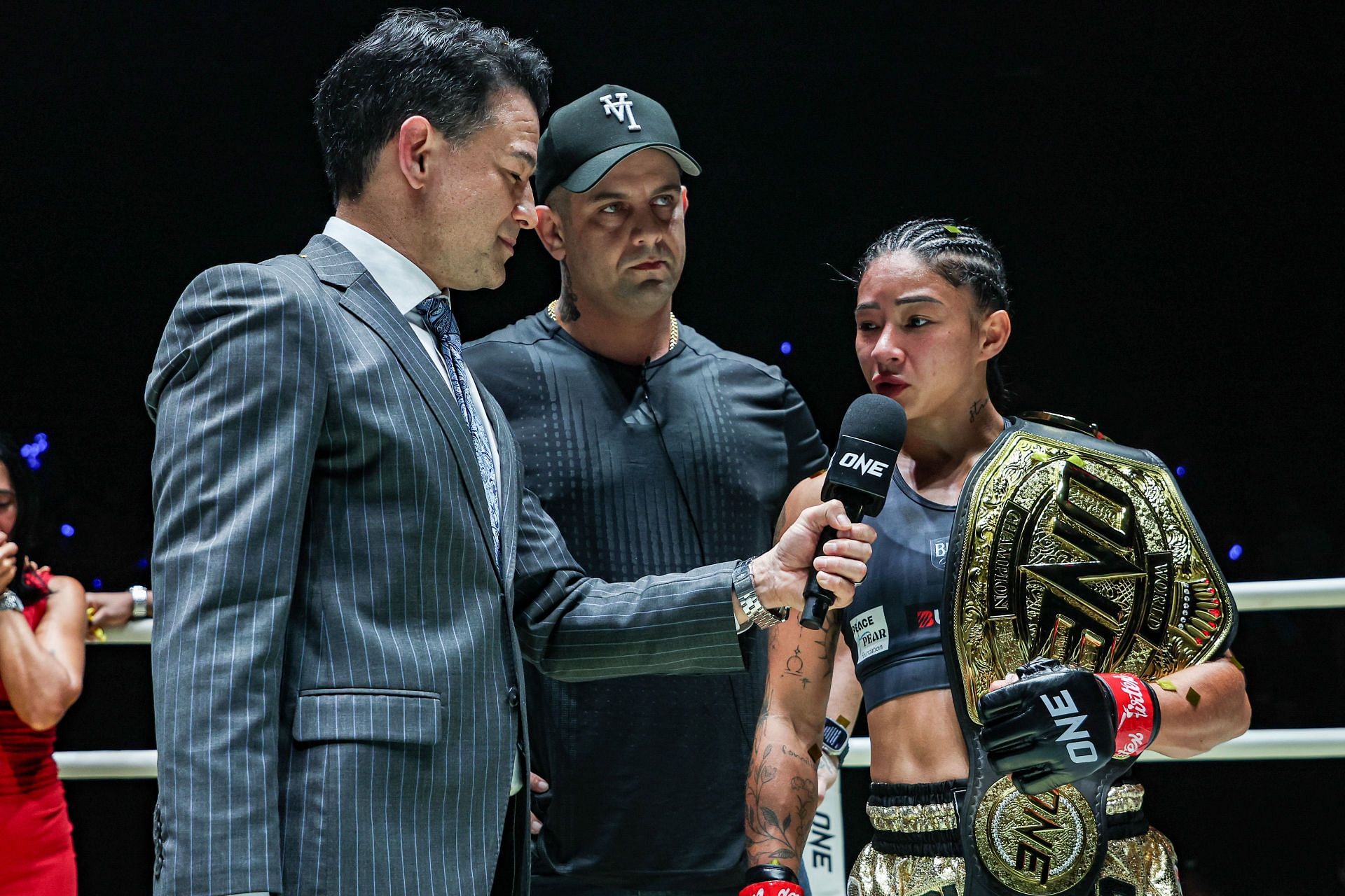 Allycia Hellen Rodrigues and head coach Leo Elias (center). [Image courtesy from ONE Championship]