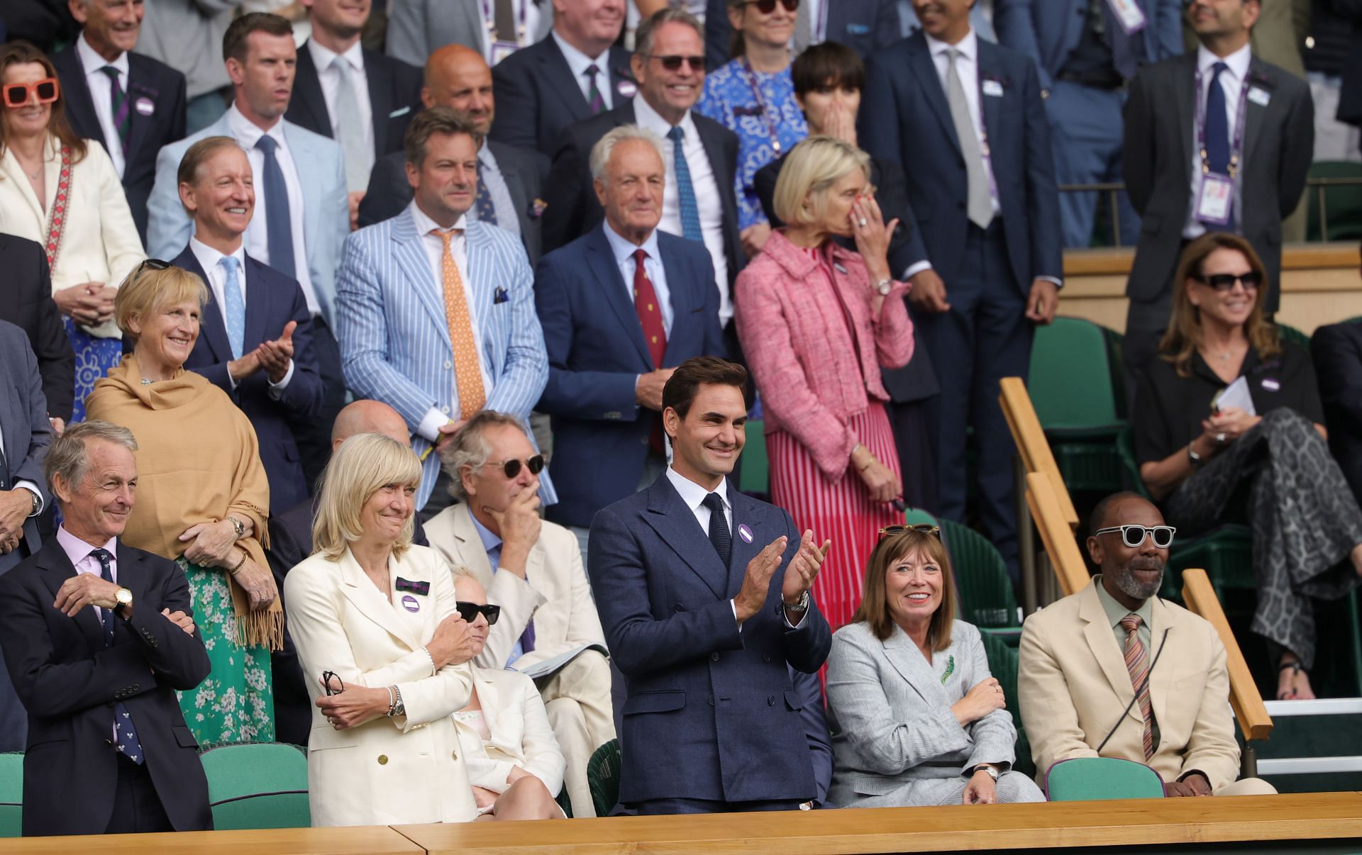 Roger Federer applauds Novak Djokovic from the stands - Image Source: Getty