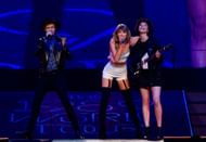 Singer-songwriters Beck, Taylor Swift, and St. Vincent perform onstage during Taylor Swift The 1989 World Tour Live In Los Angeles at Staples Center on August 25, 2015. (Image via Getty)
