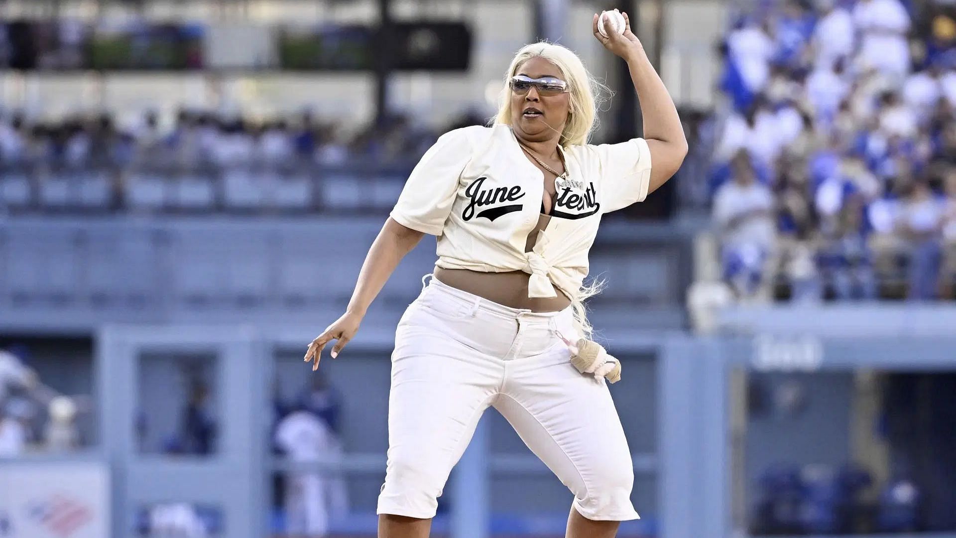 Lizzo tossed out the ceremonial pitch prior to a baseball game between the San Diego Padres and the Los Angeles Dodgers at Dodger Stadium (Image via Getty)