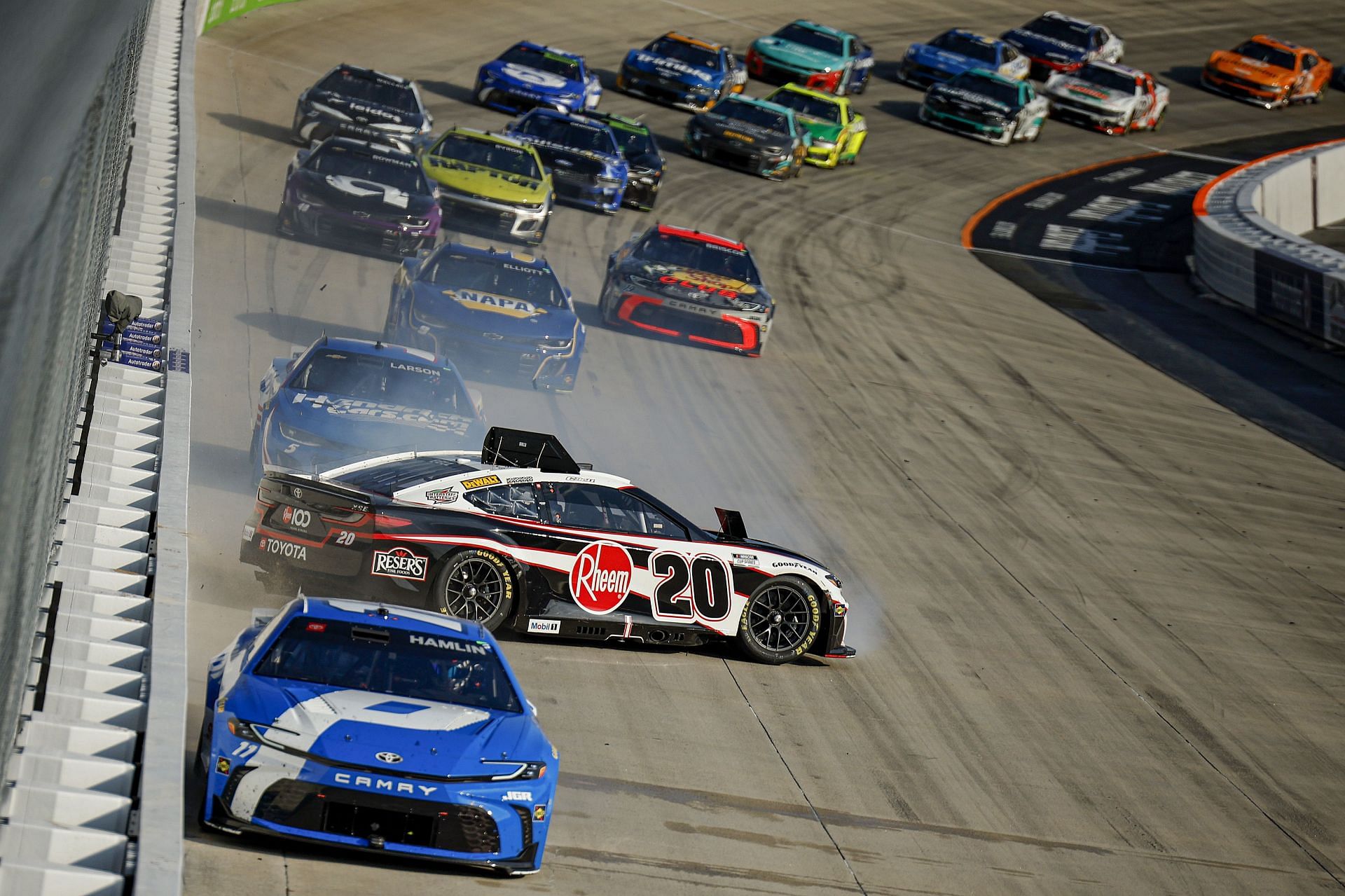 Christopher Bell (20) spins in overtime of the NASCAR Cup Series AutoTrader EchoPark Automotive 400. Source: Getty