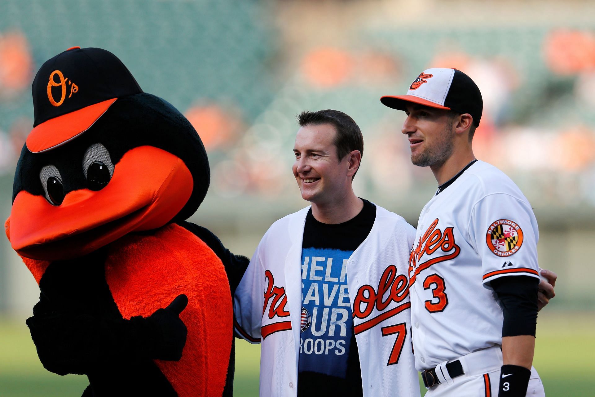 (L-R) The Oriole Bird Mascot, Kurt Busch, and Ryan Flaherty at Oriole Park in 2013. Source: Getty