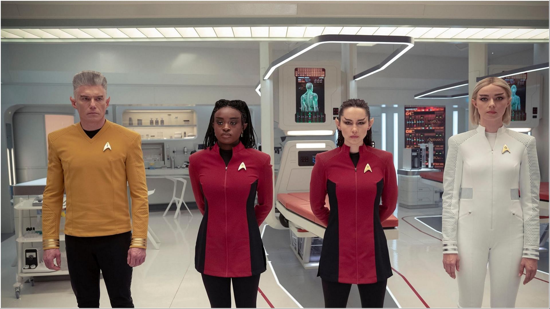 Anson Mount as Captain Pike in a gold uniform, Celia Rose Gooding as Uhura, Christina Chong as La
