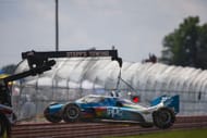 Josef Newgarden's crashed car gets towed by safety crew at IndyCar's Honda Indy 200 at Mid-Ohio - Source: Getty