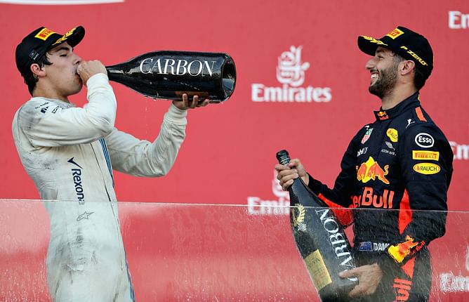 "Is he old enough to drink?": When Daniel Ricciardo forced Lance Stroll to do a shoey on his first F1 podium