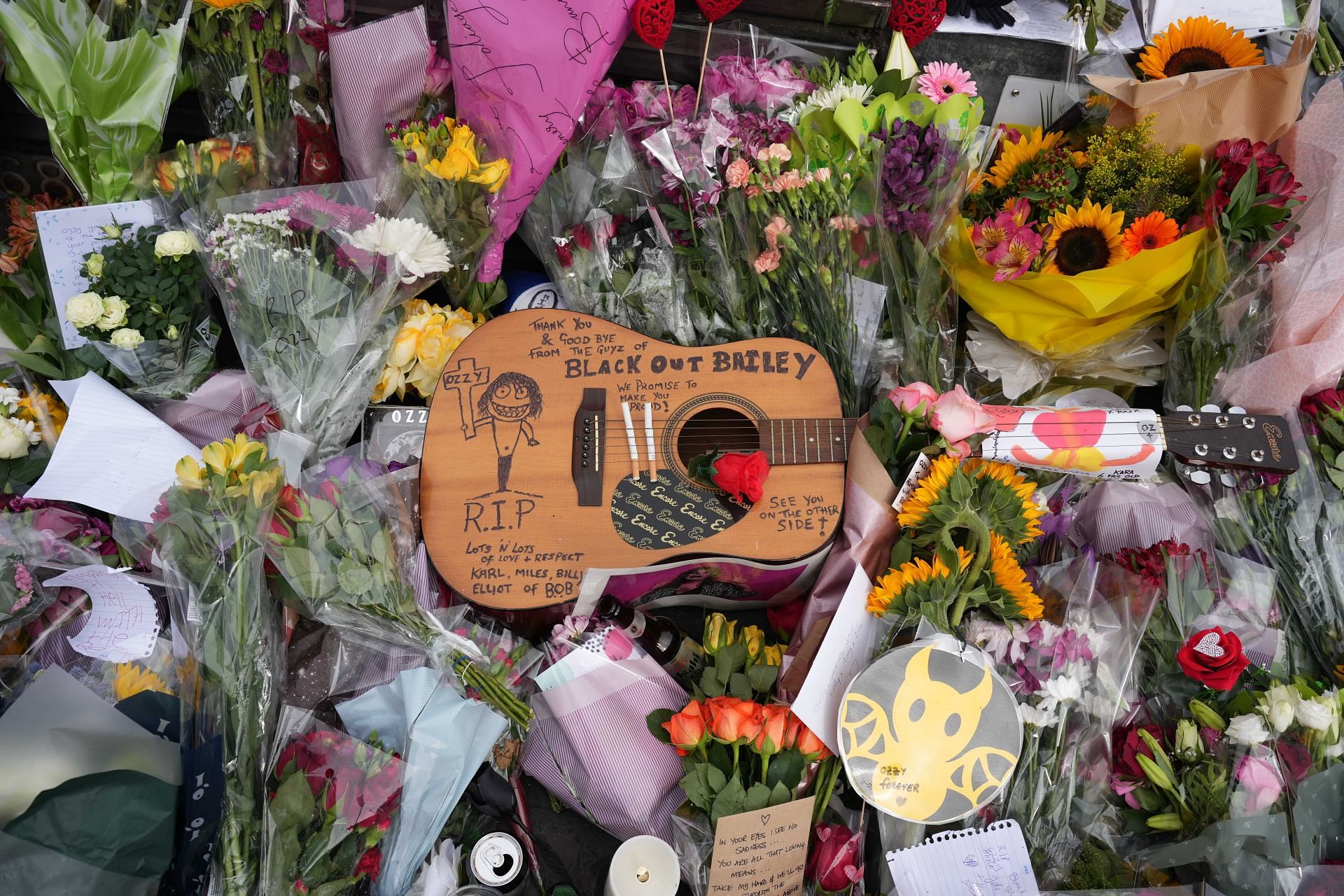 Flowers placed in Birmingham to honor late rock icon Ozzy Osbourne (Image via Getty Images)
