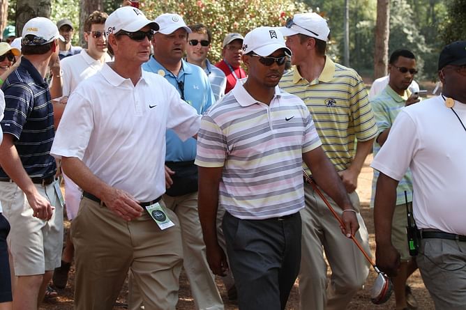 Tiger Woods' ex-coach defends the 15x major champ with a three-word response to a complaining fan