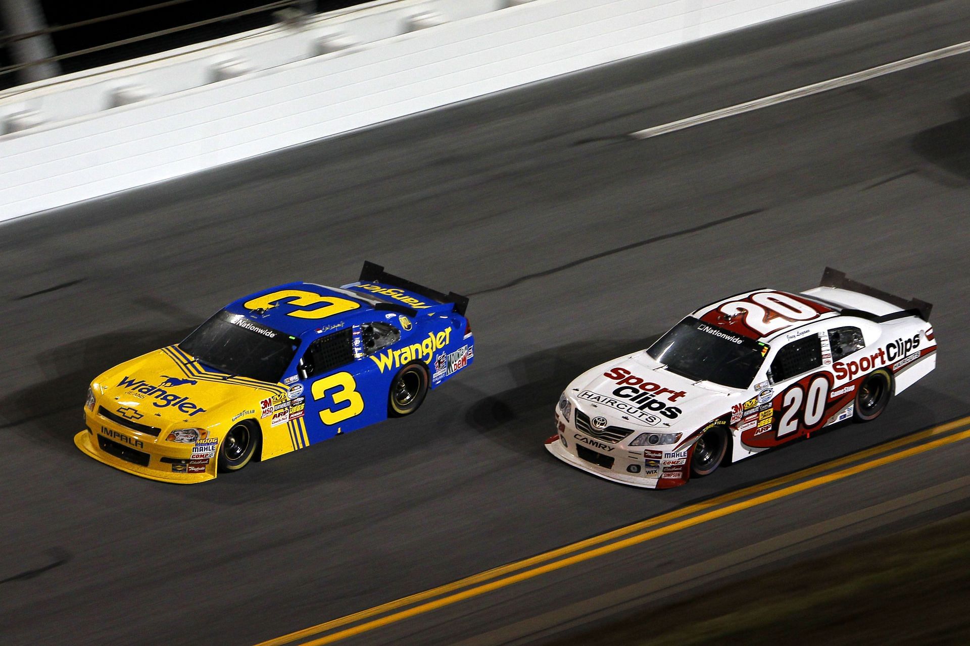 Dale Earnhardt Jr. (3) leads Joey Logano (20) during the NASCAR Nationwide Series Subway Jalapeno 250. Source: Getty