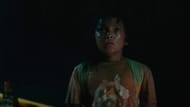 Isabel adopts a baby dinosaur (Image via YouTube/Universal Pictures)