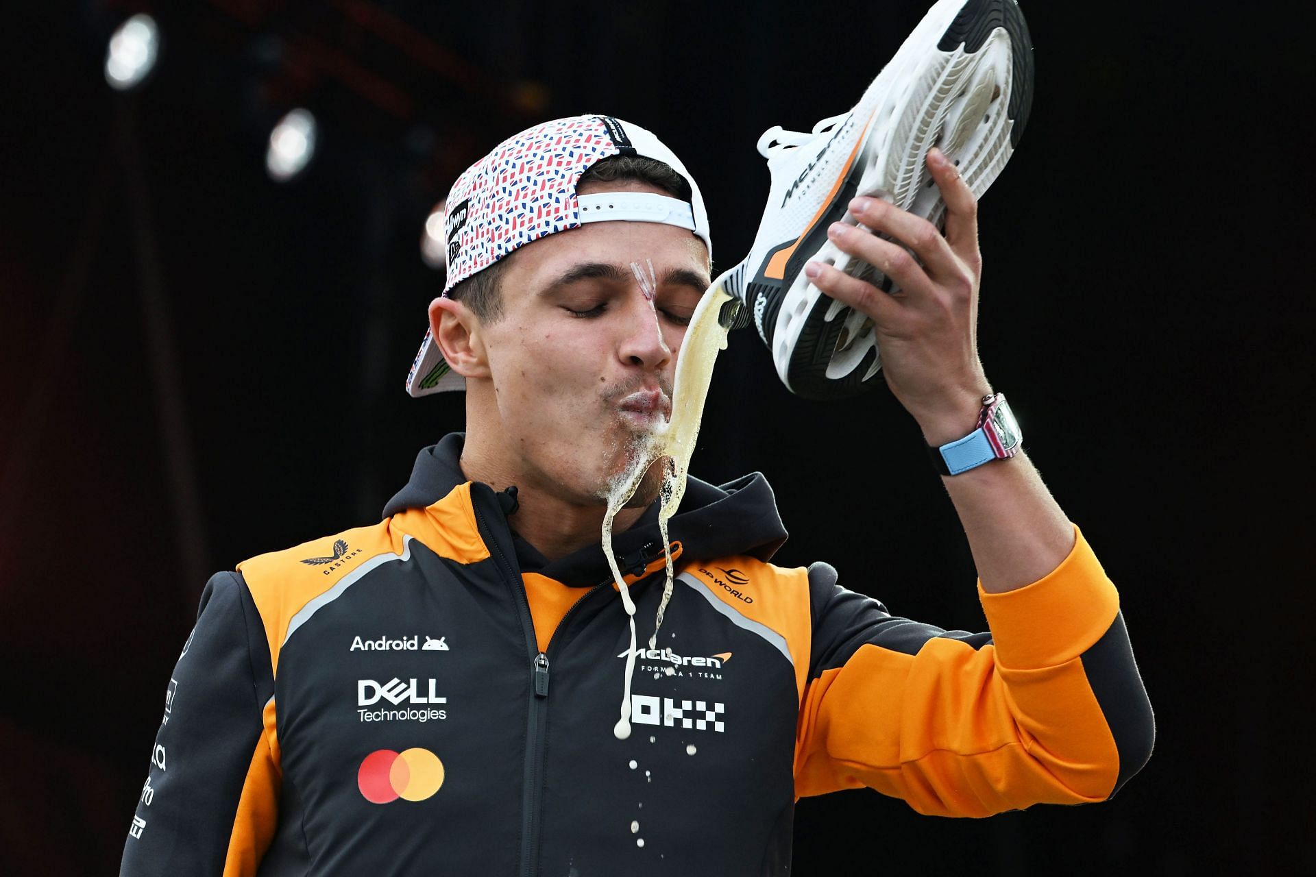Lando Norris drinks beer from a shoe after the F1 Grand Prix of Great Britain. Source: Getty