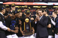 Duke Blue Devils celebrate with the NCAA trophy on the podium after beating the Wisconsin Badgers 68-63 in the 2015 NCAA Men's Division I Championship game at Lucas Oil Stadium. Photo: Imagn