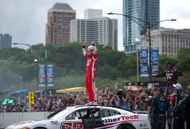 Shane van Gisbergen and the Trackhouse Racing crew celebrate the NASCAR Cup Series Grant Park 165. Source: Getty