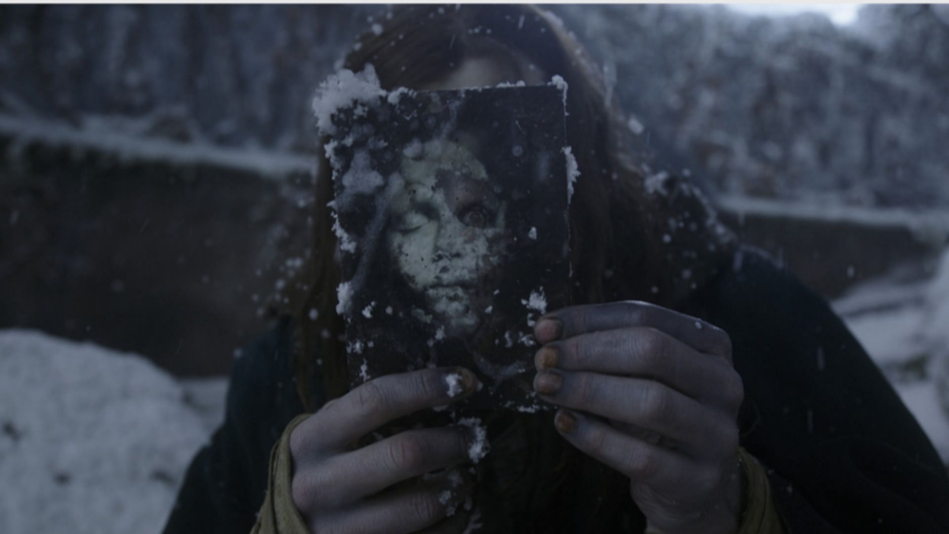 In Frankenstein 2025, Jacob Elordi&rsquo;s Creature examines a war photo that mirrors his own likeness, emphasizing the film&rsquo;s themes of identity and suffering. (Image via Netflix)