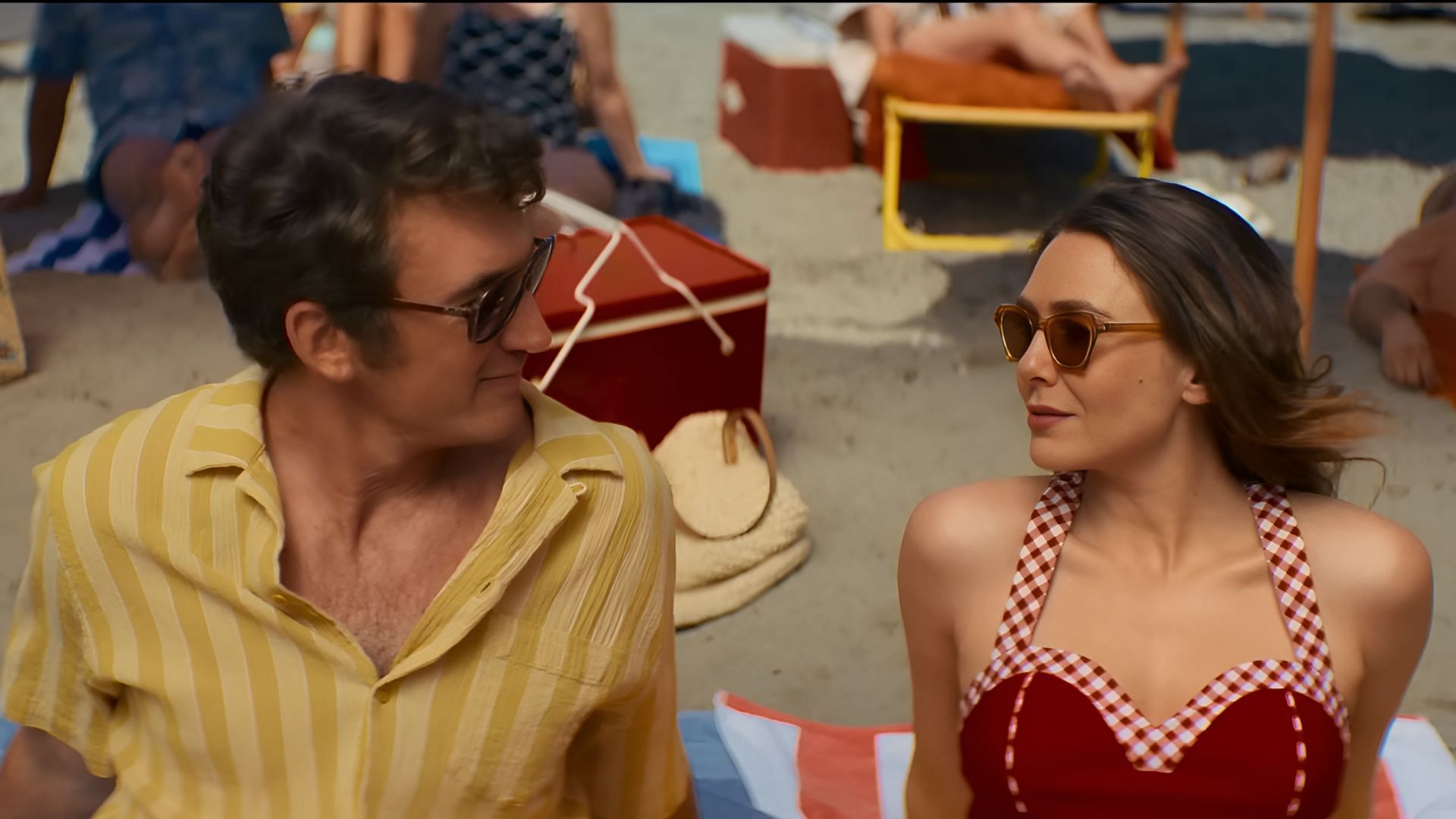 Joan and Larry share a peaceful moment in the afterlife in Eternity, one of many surreal destinations where love and memory collide. (Image via A24)