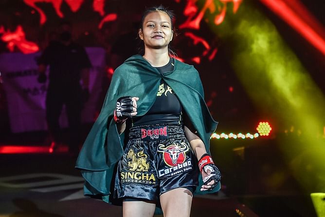 Supergirl enlists aid of "sports science coach" to help her prepare for return to action at ONE Fight Night 34