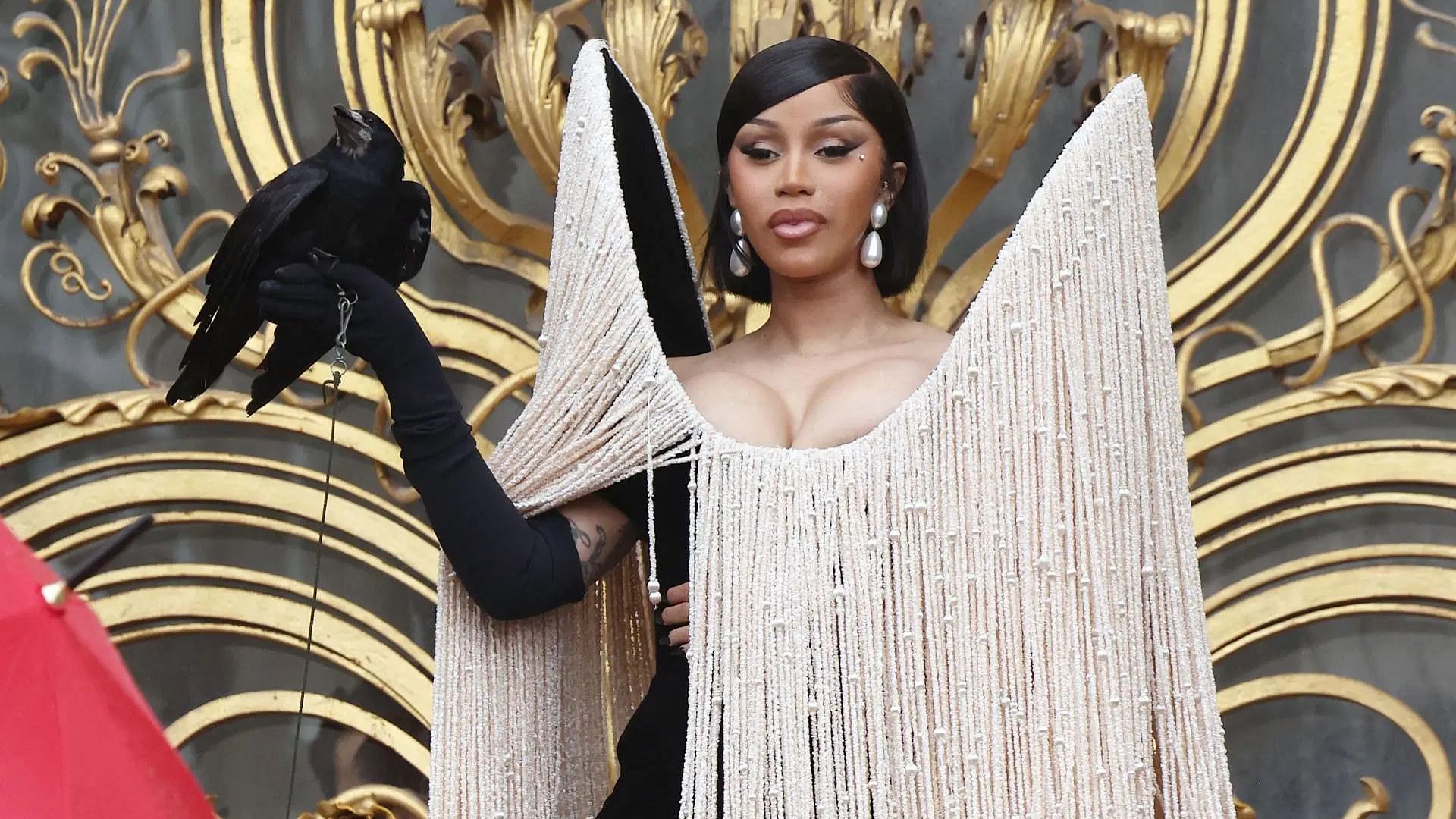 Cardi V outside Schiaparelli, during Paris Fashion Week (Image via Getty)