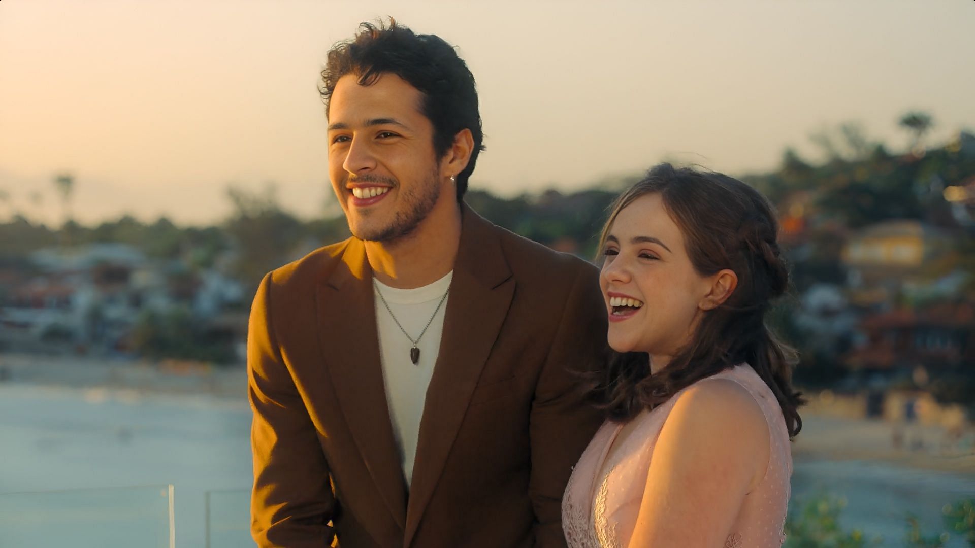 Miguel and Mariana share a joyful moment at the beachside ceremony (Image via Netflix)