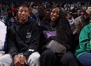 Flau'jae Johnson reacts as boyfriend Chris Hilton Jr arrives at Atlanta with the LSU football squad