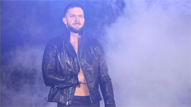 Finn Balor sits with five WWE titles and sends three-word message
