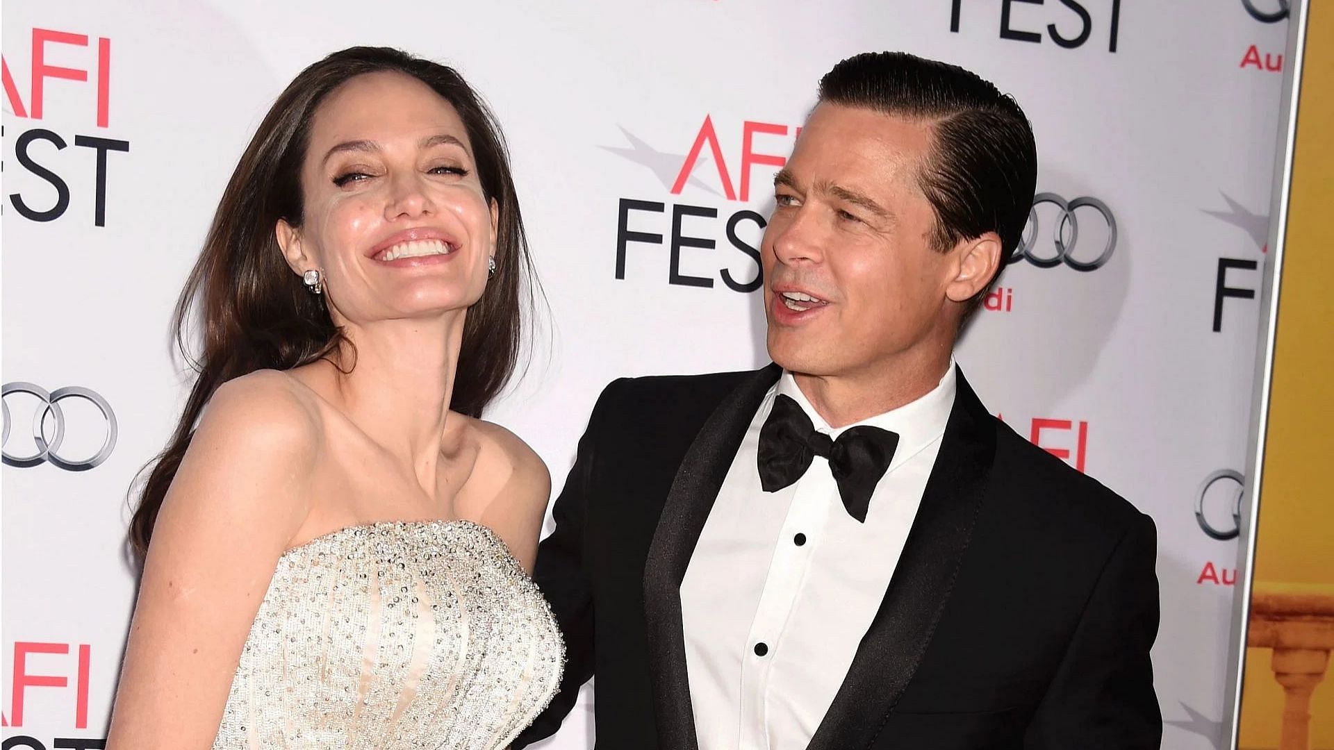 Angelina Jolie Pitt (L) and actor-producer Brad Pitt arrive at the AFI FEST 2015 presented by Audi Opening Night Gala Premiere of Universal Pictures