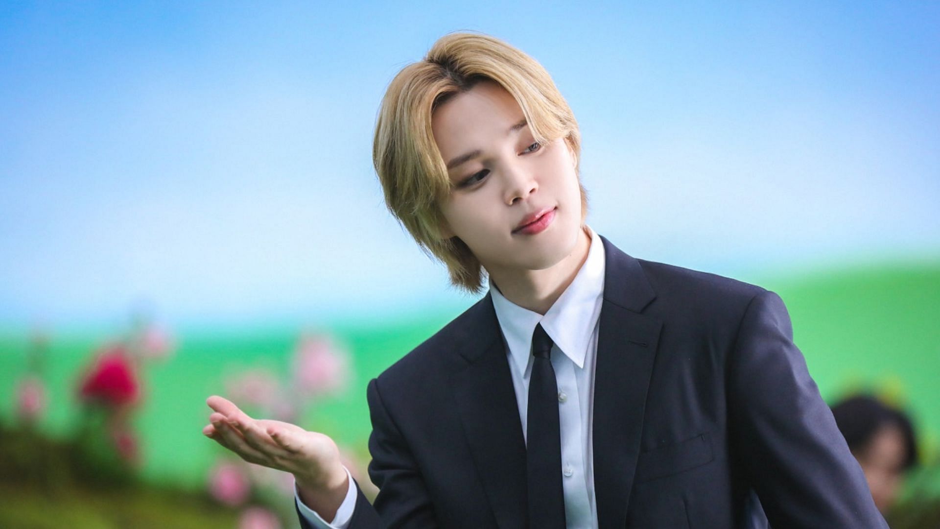 Jimin gets awarded a plaque for his philanthrophic efforts (Image via Weverse)