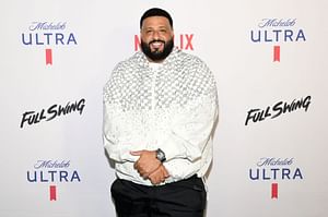 DJ Khaled celebrates Justin Bieber's new album "SWAG" by jumping into the ocean on family vacation
