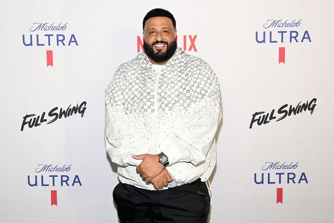 DJ Khaled celebrates Justin Bieber's new album "SWAG" by jumping into the ocean on family vacation