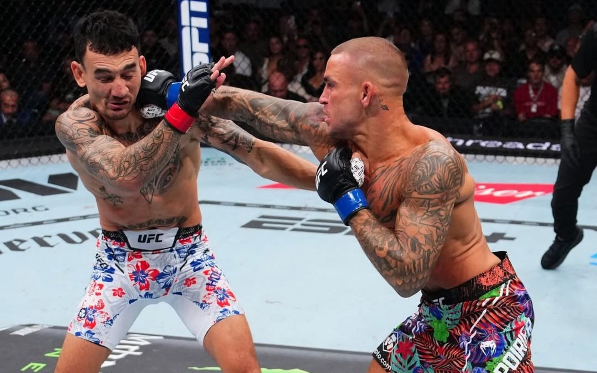 Max Holloway (left) fought Dustin Poirier (right) at UFC 318. [Image courtesy: @ufceurope on Instagram]
