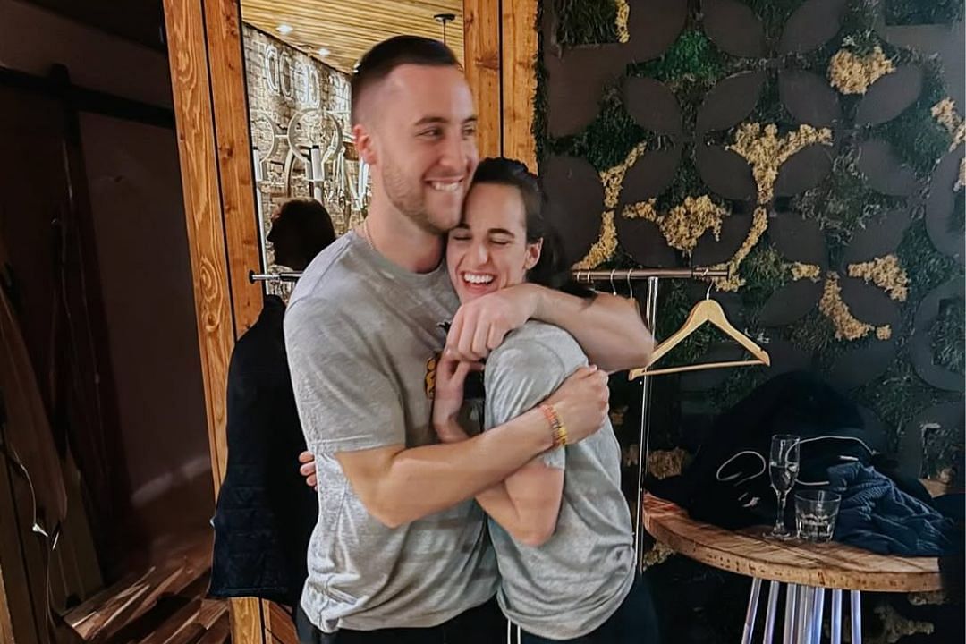 Former Pacers team assistant Connor McCaffery hugs his girlfriend and Indiana Fever guard Caitlin Clark   