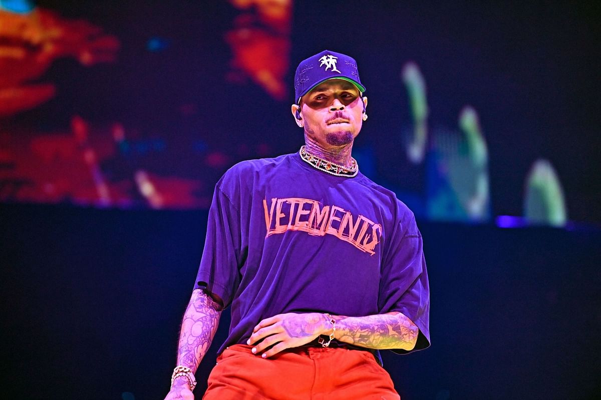 "What does one even do with 6 women??" — Internet reacts to Chris Brown leaving his Paris hotel with a barrage of women