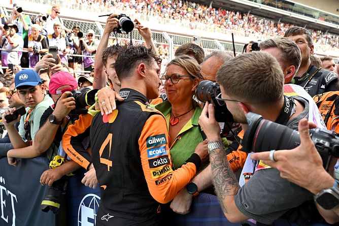 Watch: An emotional Lando Norris tries to hide his tears as his mother hugs him after winning the F1 British GP